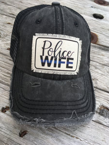 Police Wife. Raggedy Black Hat