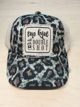 Top knot double shot. Leopard crisscross hat